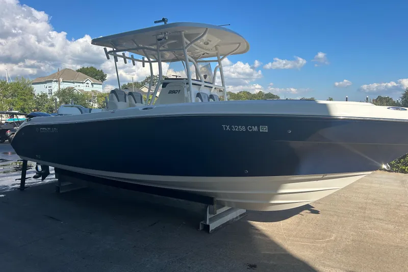 Slide: The Image of 2015 Century 2901 Center Console boat on display under a clear blue sky. - 6