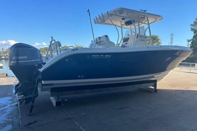 Slide: The Image of 2015 Century 2901 Center Console boat with Yamaha engine on a dock. - 7