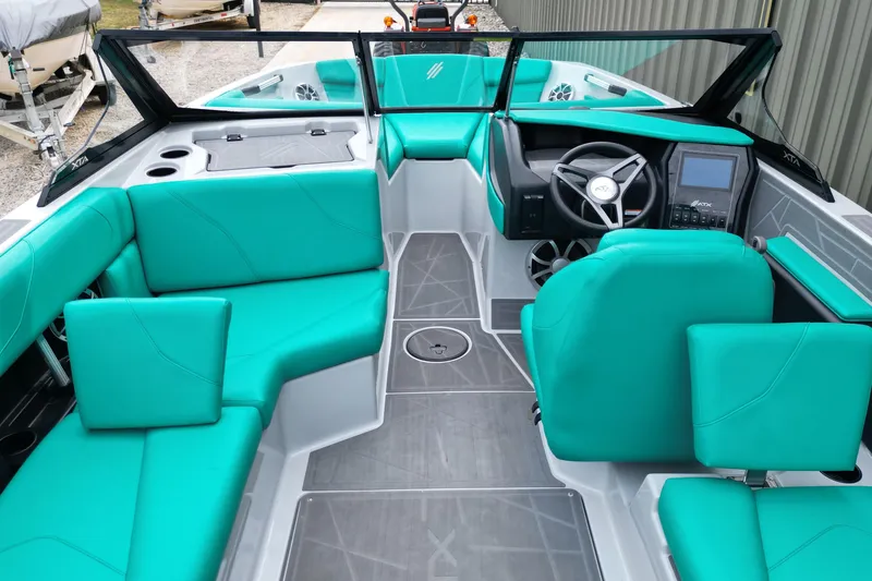 Slide: The Image of 2021 ATX Surf Boats 20 Type-S interior with teal seating and modern dashboard. - 10