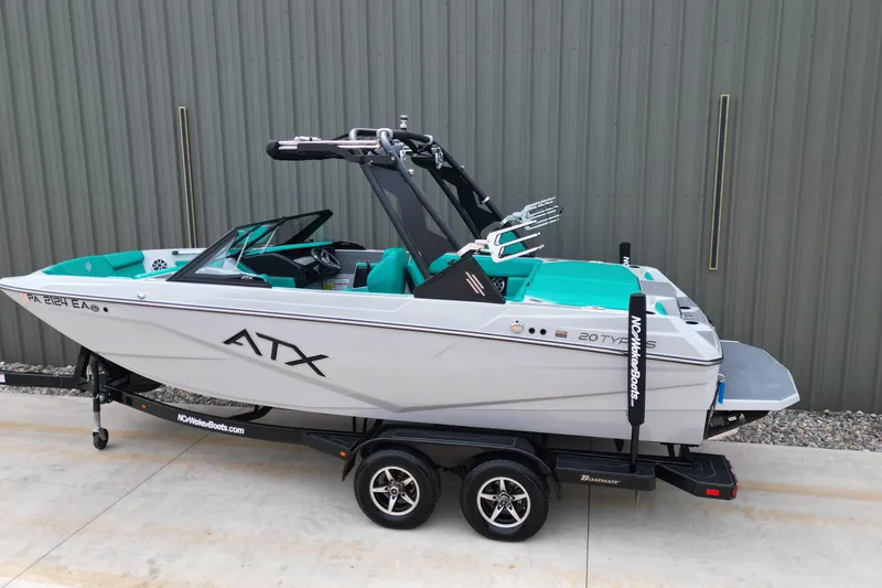 Slide: The Image of 2021 ATX Surf Boats 20 Type-S on trailer, teal interior, parked outdoors. - 3