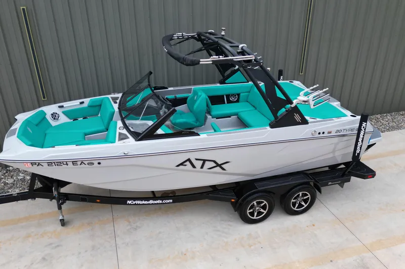 Slide: The Image of 2021 ATX Surf Boats 20 Type-S on trailer, featuring teal interior and sleek design. - 4