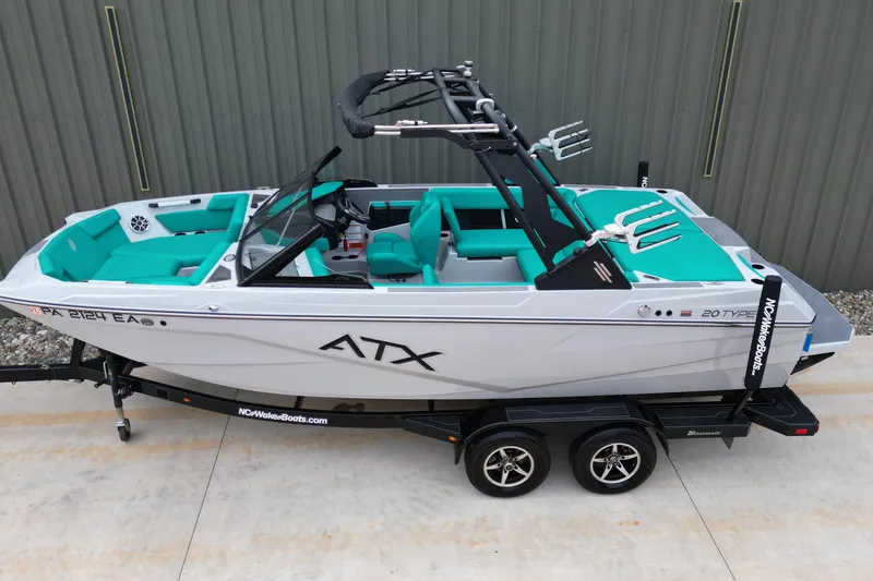 Slide: The Image of 2021 ATX Surf Boats 20 Type-S on trailer, featuring teal interior and sleek design. - 5