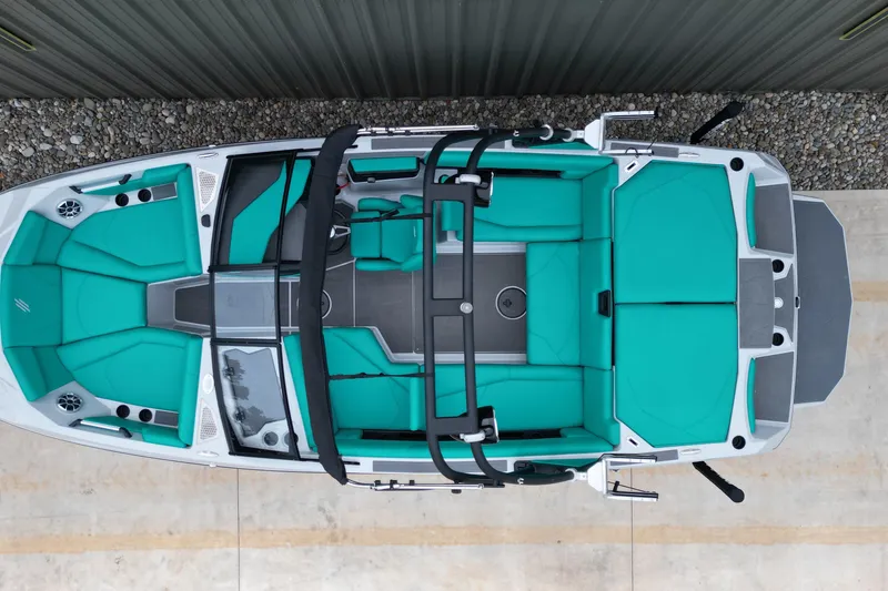 Slide: The Image of 2021 ATX Surf Boats 20 Type-S with teal interior, aerial view. - 7