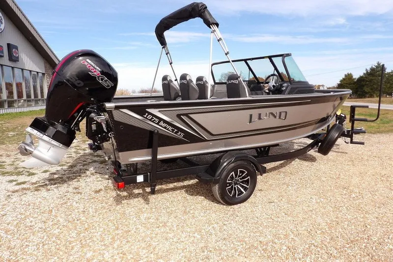 Slide: The Image of Carpeted storage compartment in 2026 Lund 1875 Impact XS Sport boat. - 14