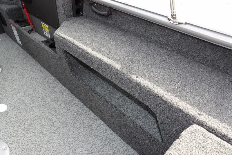 Slide: The Image of Interior view of 2026 Lund 1875 Impact XS Sport boat storage compartment. - 15