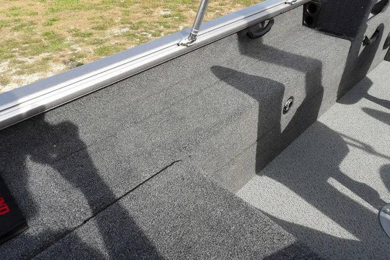 Slide: The Image of Storage compartment of 2026 Lund 1875 Impact XS Sport boat with cables inside. - 19