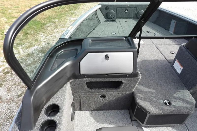 Slide: The Image of 2026 Lund 1875 Impact XS Sport boat interior with seating and storage compartments. - 29