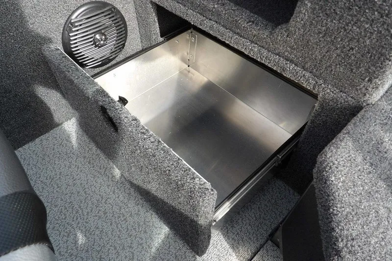 Slide: The Image of 2026 Lund 1875 Impact XS Sport boat interior with steering wheel and dashboard. - 33