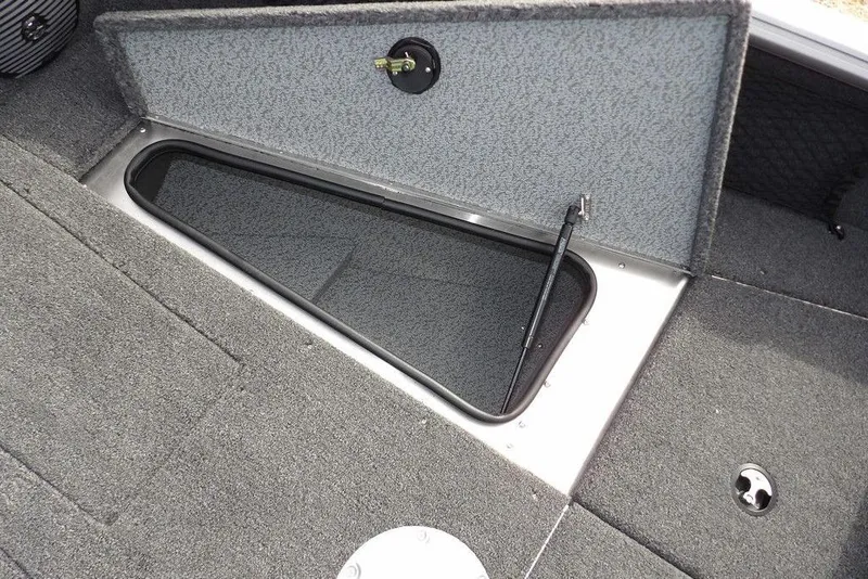 Slide: The Image of 2026 Lund 1875 Impact XS Sport boat interior with speakers and storage compartments. - 40