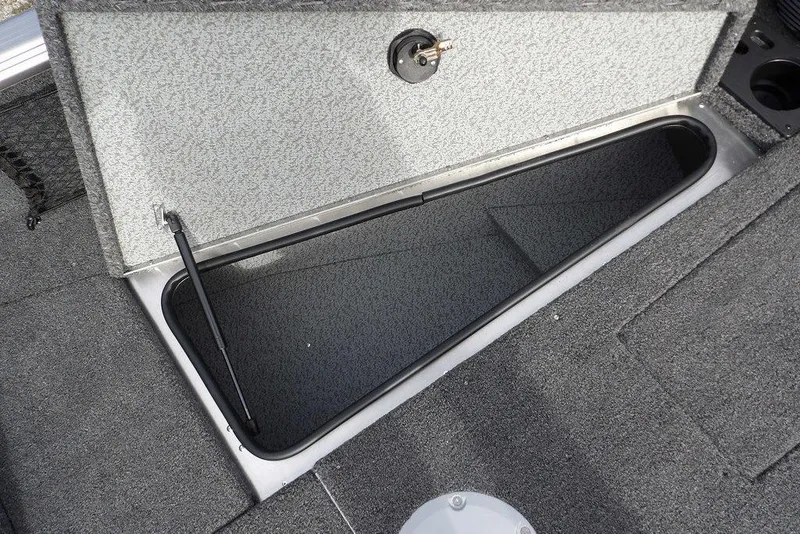 Slide: The Image of 2026 Lund 1875 Impact XS Sport boat interior with carpeted deck and storage compartments. - 41