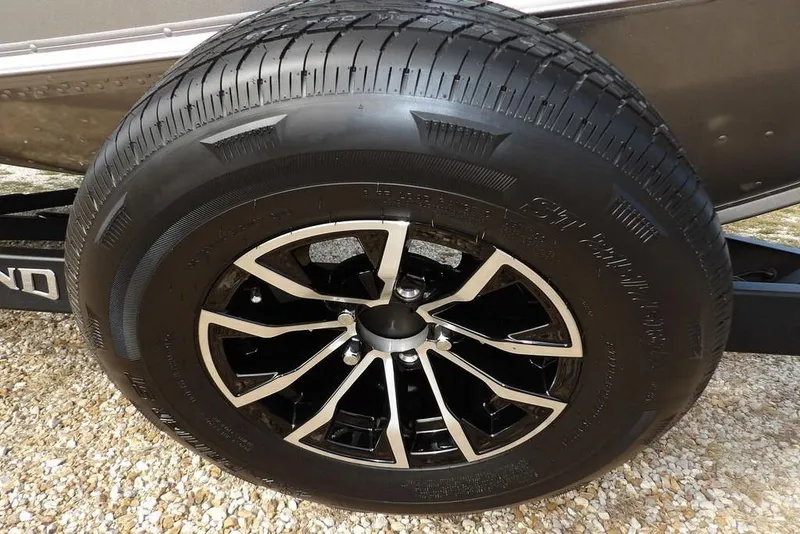 Slide: The Image of 2026 Lund 1875 Impact XS Sport interior with speakers and storage compartment. - 47