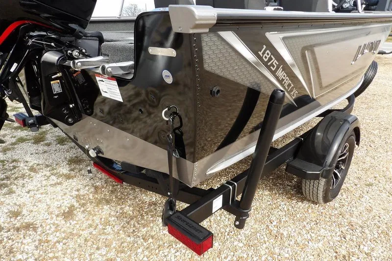 Slide: The Image of 2026 Lund 1875 Impact XS Sport boat decal with geometric design. - 50