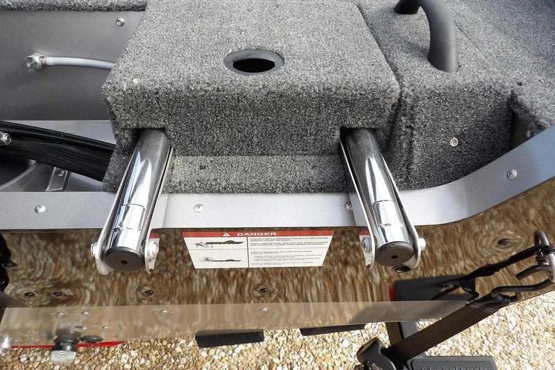 Slide: The Image of 2026 Lund 1875 Impact XS Sport trailer wheel on gravel surface. - 51