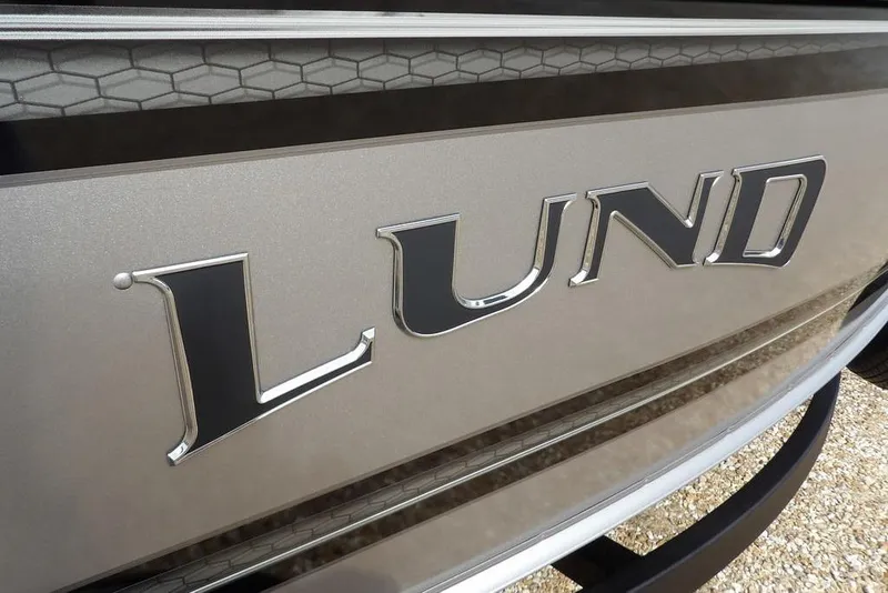 Slide: The Image of Close-up of 2026 Lund 1875 Impact XS Sport boat engine with '150 Pro' branding. - 54