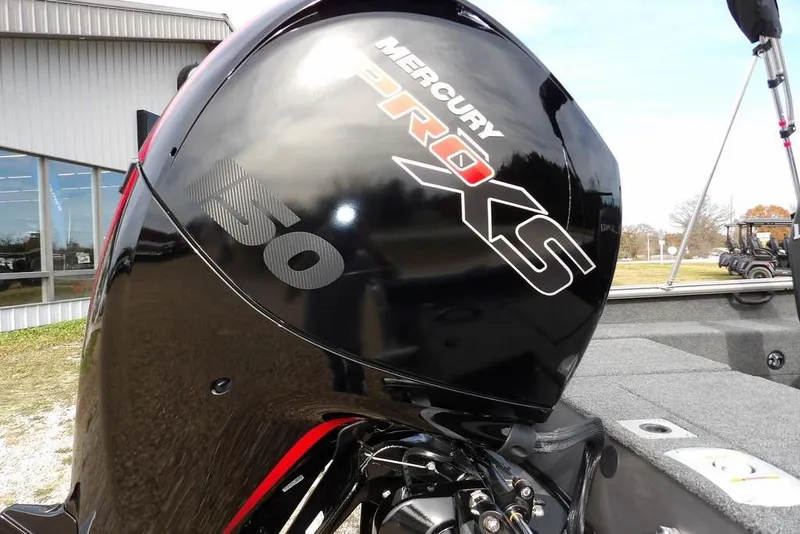 Slide: The Image of Propeller of 2026 Lund 1875 Impact XS Sport boat on gravel surface. - 55