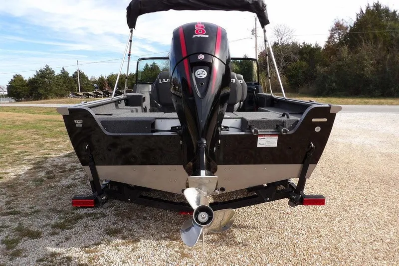 Slide: The Image of 2026 Lund 1875 Impact XS Sport boat interior with gray carpeted deck. - 9