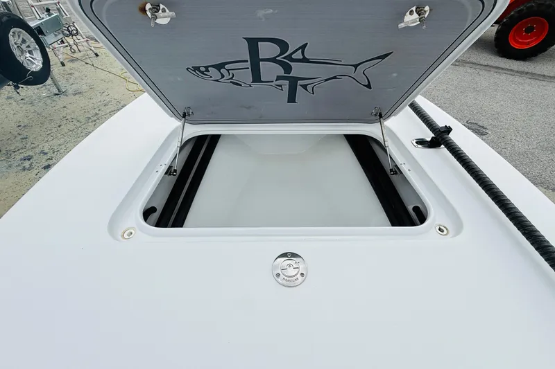 Slide: The Image of Open storage compartment on a 2021 Beavertail Skiffs 18 Mosquito boat. - 6