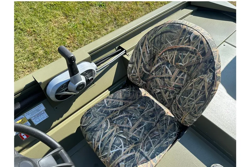 Slide: The Image of 2026 Lowe Roughneck 1860SC boat seat with camouflage pattern and control panel. - 18