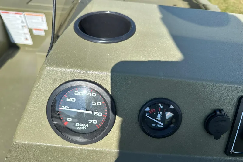 Slide: The Image of Dashboard of 2026 Lowe Roughneck 1860SC boat with RPM and fuel gauges. - 23