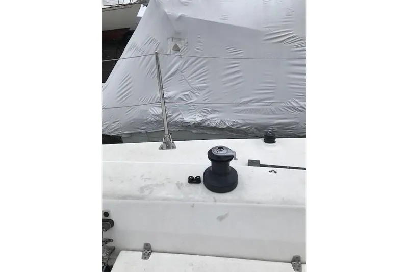 Slide: The Image of Deck of a 1997 JBoat J 105 sailboat with winch and covered sail. - 10