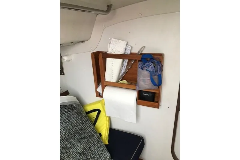 Slide: The Image of Interior of 1997 JBoat J 105 with wooden storage and nautical equipment. - 19