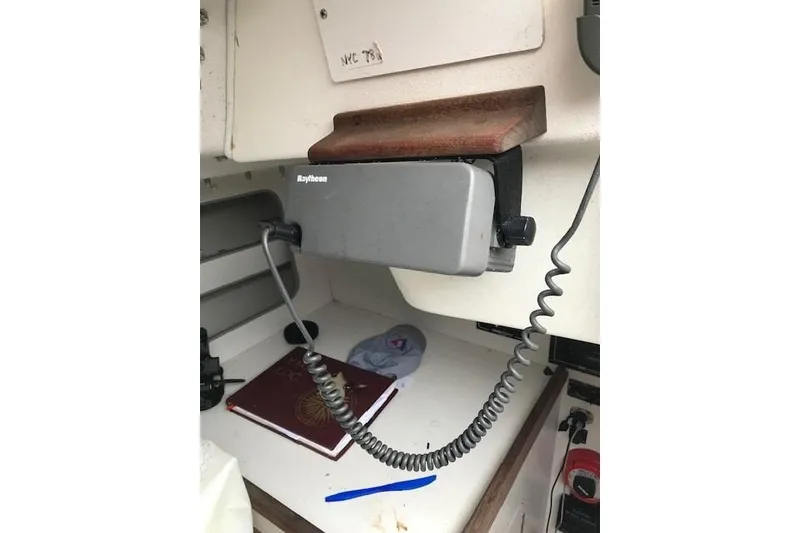 Slide: The Image of Interior of a 1997 JBoat J 105 featuring a Raytheon marine radio. - 20