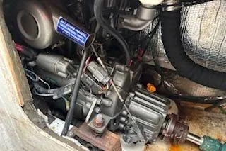 Slide: The Image of Engine compartment of a 1997 J Boats J 105 sailboat, showing mechanical components. - 30