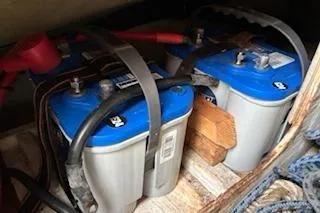 Slide: The Image of Batteries in a 1997 J Boats J 105 sailboat, secured with straps. - 33