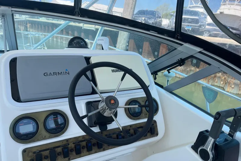 Slide: The Image of Century 3200 Walk-Around 2002 boat helm with Garmin and Humminbird electronics. - 10
