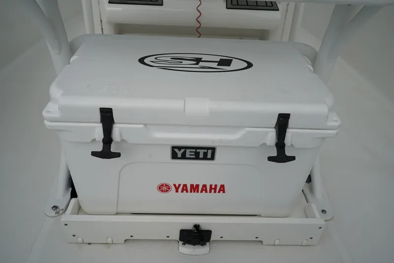 Slide: The Image of YETI cooler on 2022 Sea Hunt Ultra 229 boat with Yamaha branding. - 11