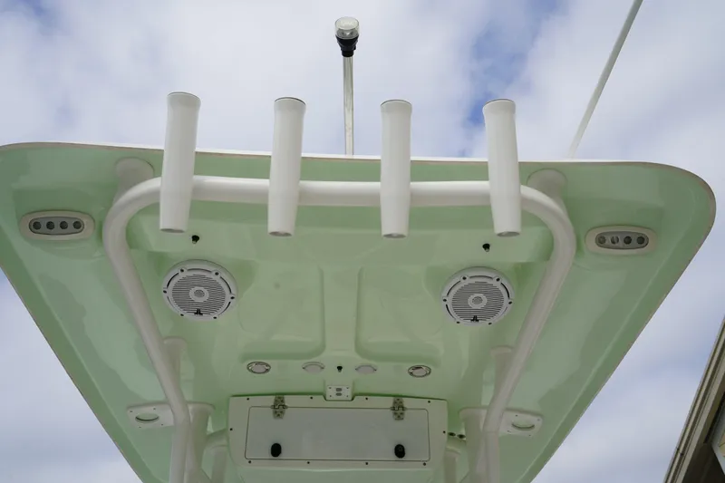 Slide: The Image of 2022 Sea Hunt Ultra 229 boat roof with rod holders and speakers. - 13