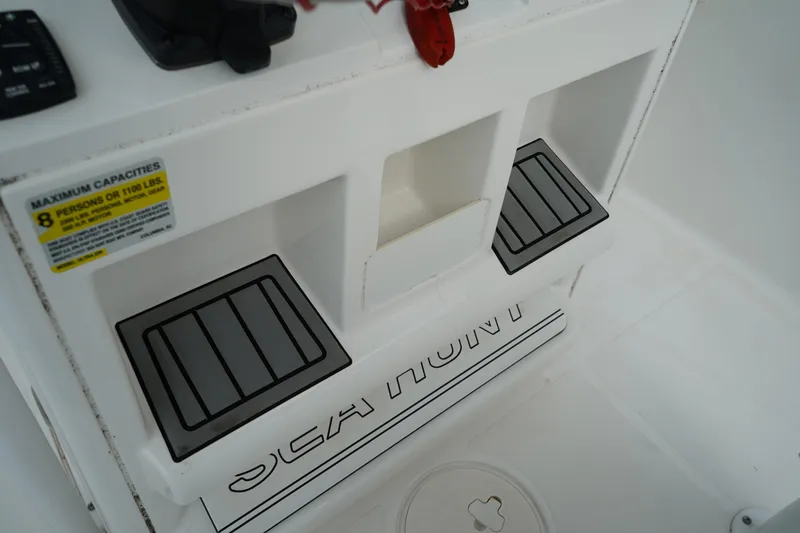 Slide: The Image of 2022 Sea Hunt Ultra 229 boat interior with seating and capacity label. - 16
