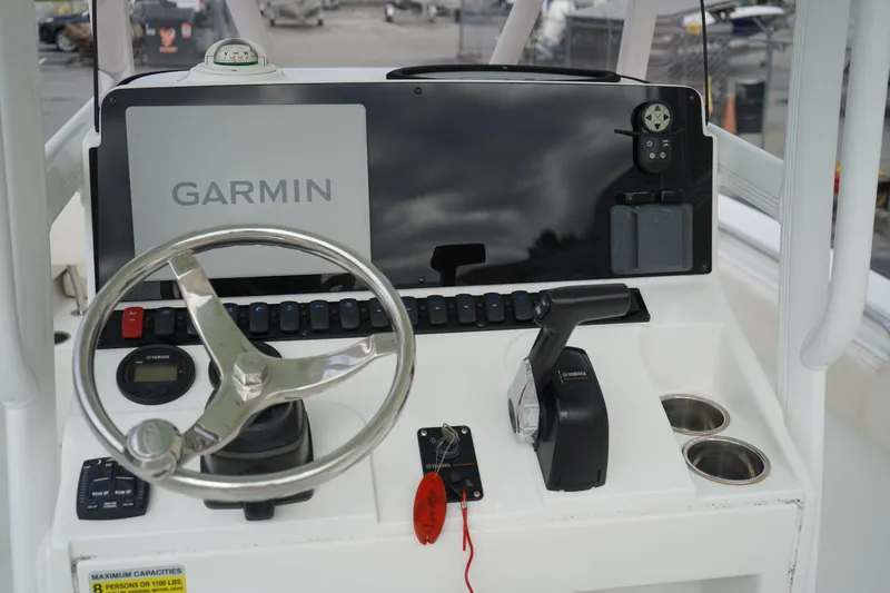 Slide: The Image of Control panel of 2022 Sea Hunt Ultra 229 boat with Garmin navigation system. - 18