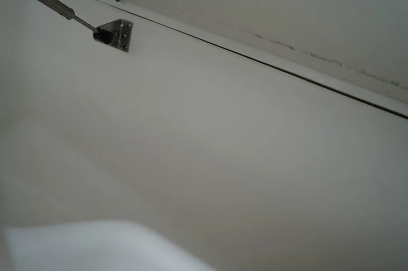 Slide: The Image of Interior detail of 2022 Sea Hunt Ultra 229 boat, featuring a metal fixture. - 27