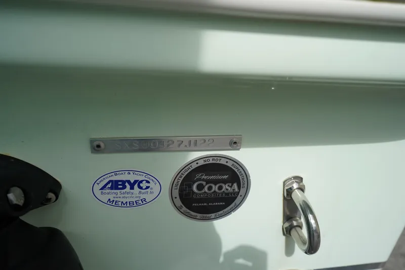 Slide: The Image of 2022 Sea Hunt Ultra 229 boat with ABYC and Coosa Composites labels. - 34