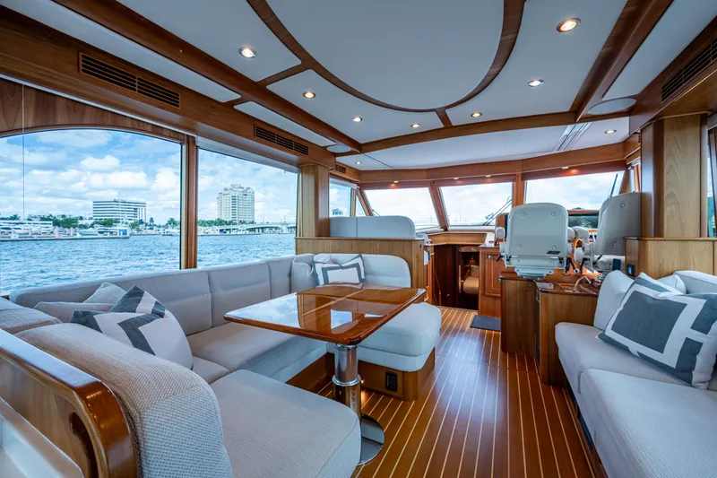 Slide: The Image of Luxurious interior of 2022 Sabre 58 Salon Express yacht with elegant wood finishes and plush seating. - 1