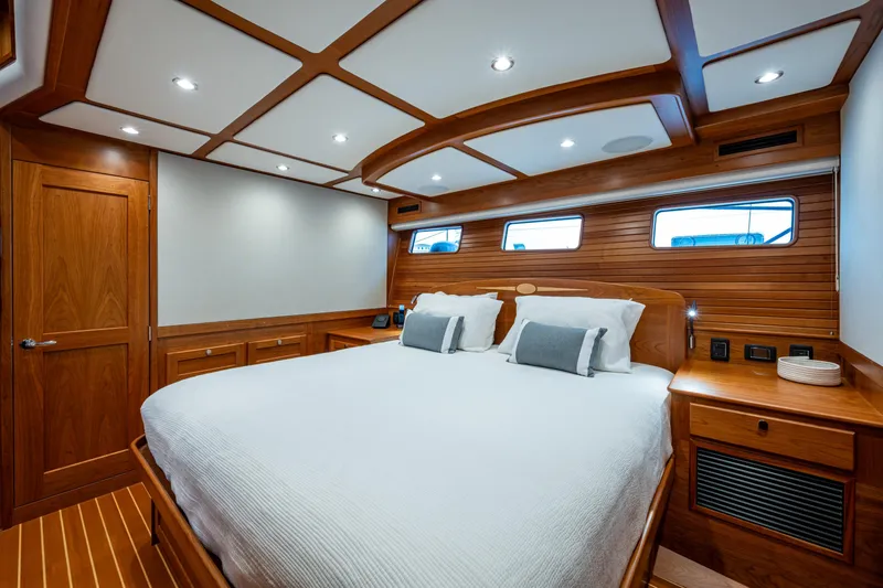 Slide: The Image of Luxurious cabin interior of 2022 Sabre 58 Salon Express yacht with elegant wood finish. - 18