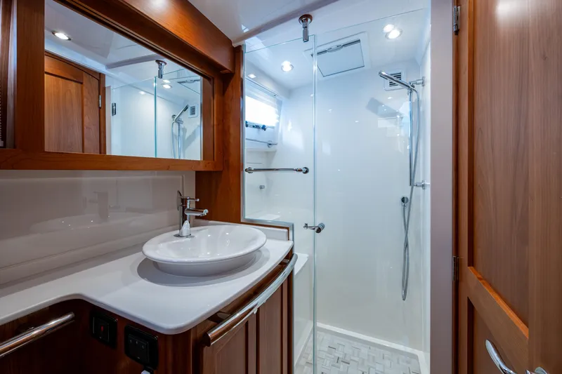 Slide: The Image of Luxurious bathroom in 2022 Sabre 58 Salon Express yacht with modern fixtures. - 21