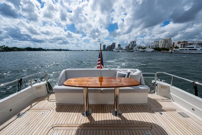 Slide: The Image of 2022 Sabre 58 Salon Express yacht deck with scenic waterfront view. - 28