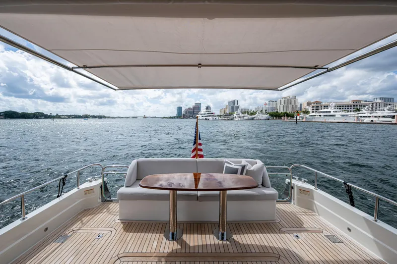 Slide: The Image of Luxury deck view on 2022 Sabre 58 Salon Express yacht, overlooking marina and cityscape. - 29