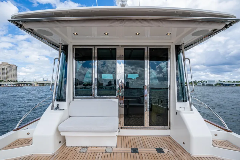 Slide: The Image of 2022 Sabre 58 Salon Express yacht with elegant deck and waterfront view. - 31