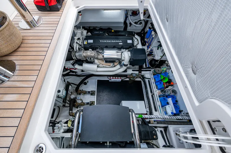 Slide: The Image of Engine compartment of 2022 Sabre 58 Salon Express yacht, featuring Volvo Penta engine. - 32