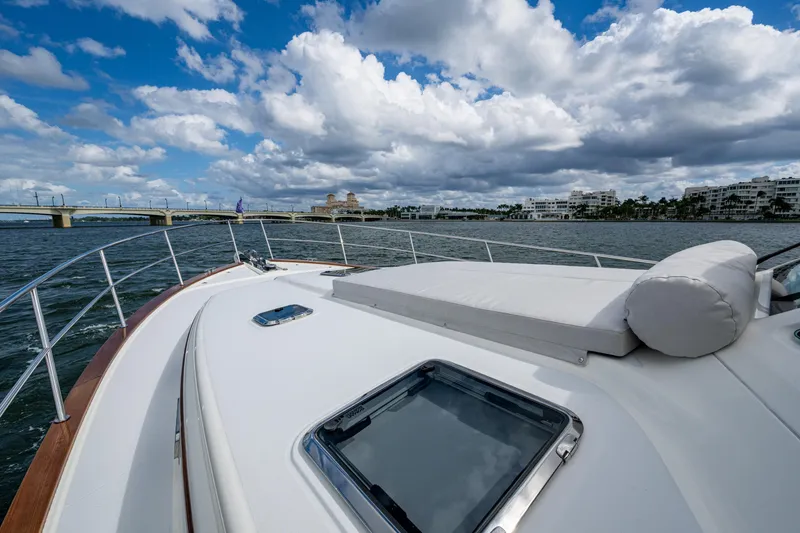 Slide: The Image of 2022 Sabre 58 Salon Express yacht deck with scenic waterfront view. - 37