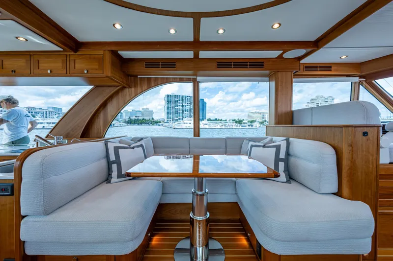 Slide: The Image of Luxurious interior of 2022 Sabre 58 Salon Express yacht with elegant seating and waterfront view. - 8