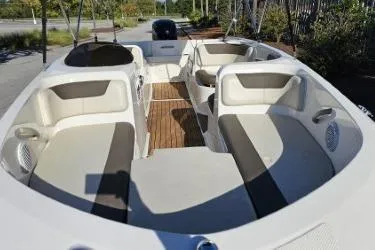 Slide: The Image of 2019 Bayliner Element E18 boat interior with spacious seating and modern design. - 2