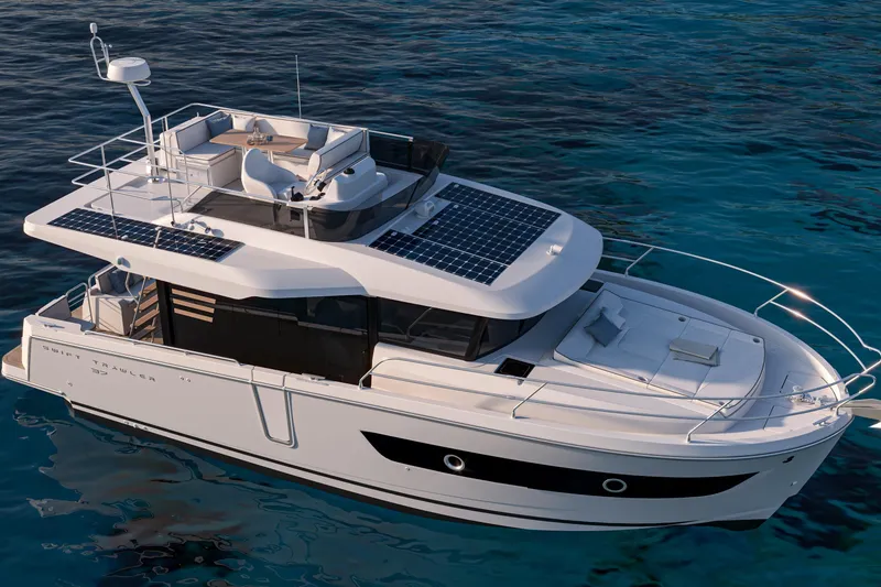 Slide: The Image of 2026 Beneteau Swift Trawler 37 Fly on calm blue water, featuring solar panels and spacious deck. - 7