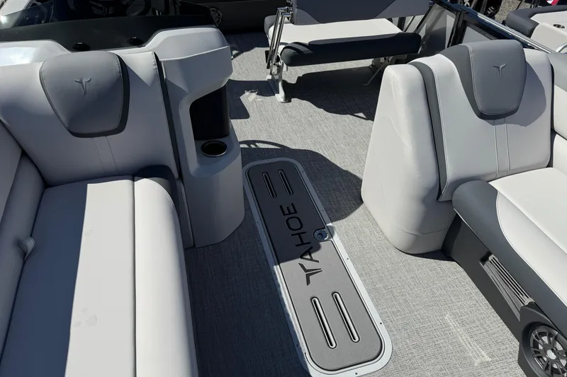 Slide: The Image of 2026 Tahoe Pontoon LTZ Entertainer interior with gray seating and flooring. - 11