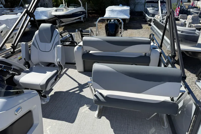 Slide: The Image of 2026 Tahoe Pontoon LTZ Entertainer interior with modern seating and sleek design. - 13