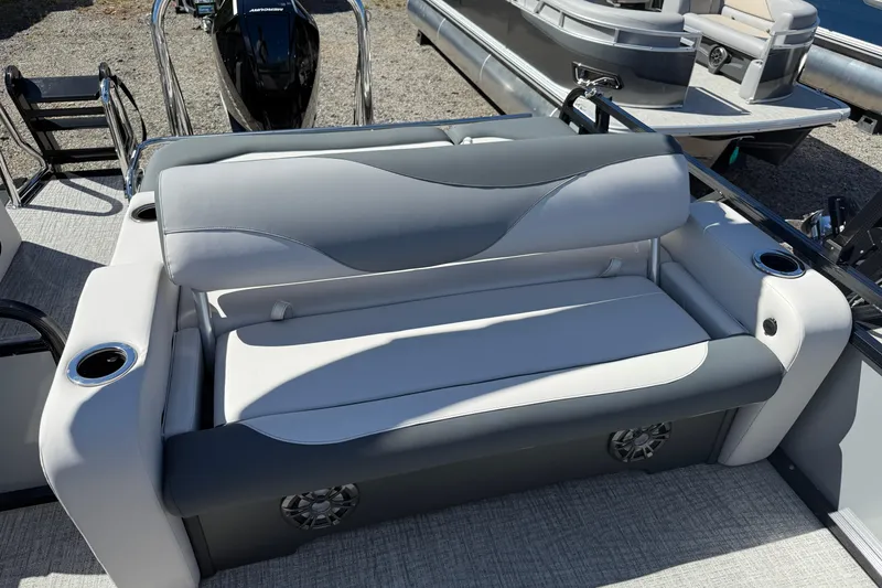 Slide: The Image of 2026 Tahoe Pontoon LTZ Entertainer boat seating with cup holders and modern design. - 6