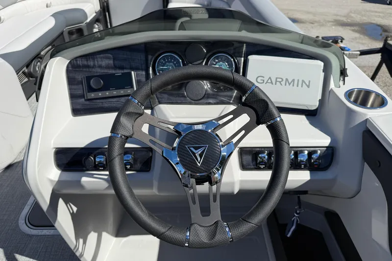 Slide: The Image of Steering wheel and dashboard of 2026 Tahoe Pontoon LTZ Entertainer with Garmin display. - 9
